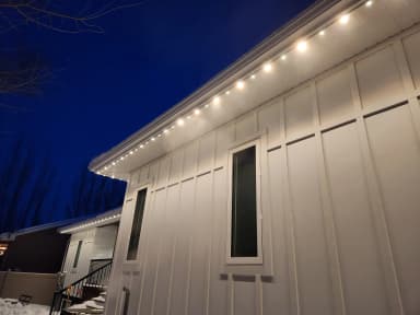 RGBW pucks lit warm white in an aluminum soffit track