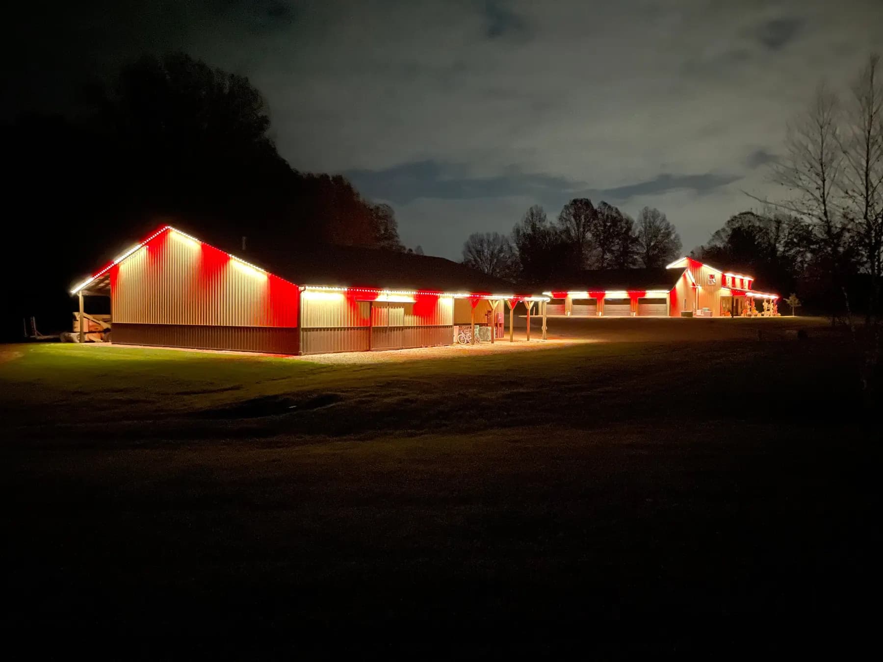 Red and white permanent lighting on a long low building for Canada Day